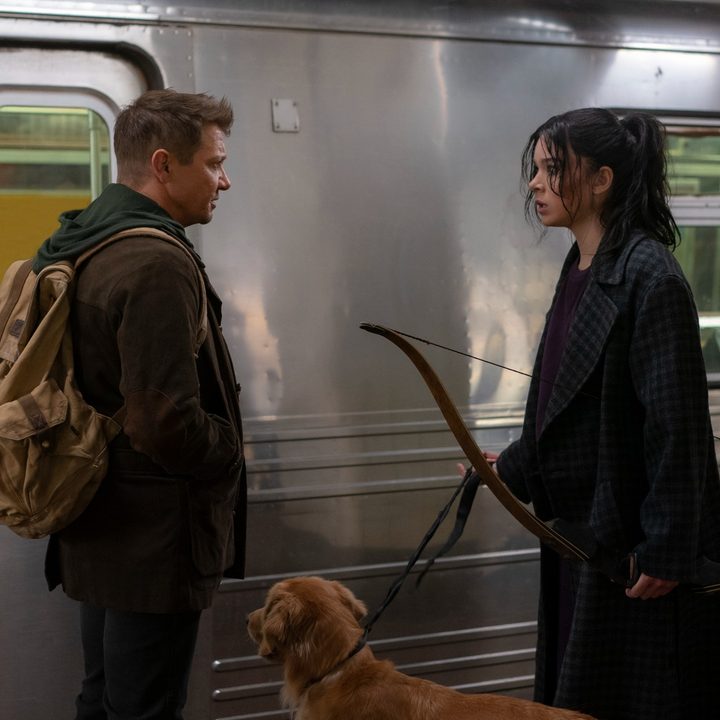 Jeremy Renner and Hailee Steinfeld stand in front of a subway car in a scene from Hawkeye.
