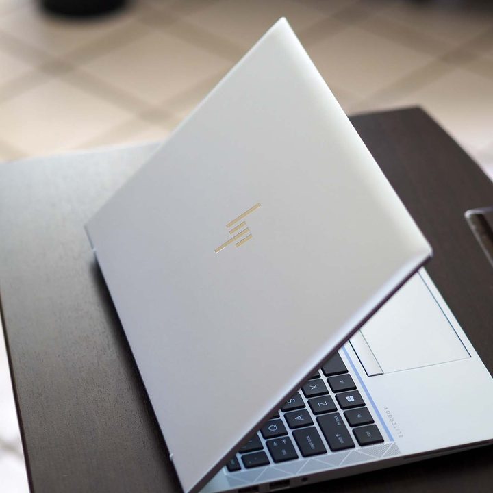 HP EliteBook 840 Aero G8 sitting on desk. Backside view of top/lid.
