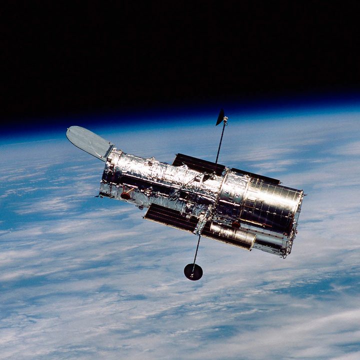 The Hubble Space Telescope floats above Earth.
