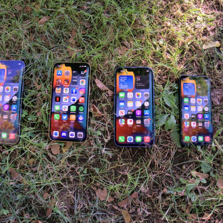 iPhone 13 models arrayed with screen on.