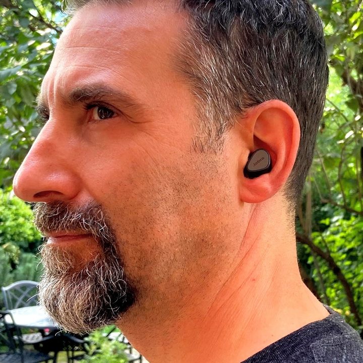 Man wearing Jabra Elite 3 true wireless earbuds.
