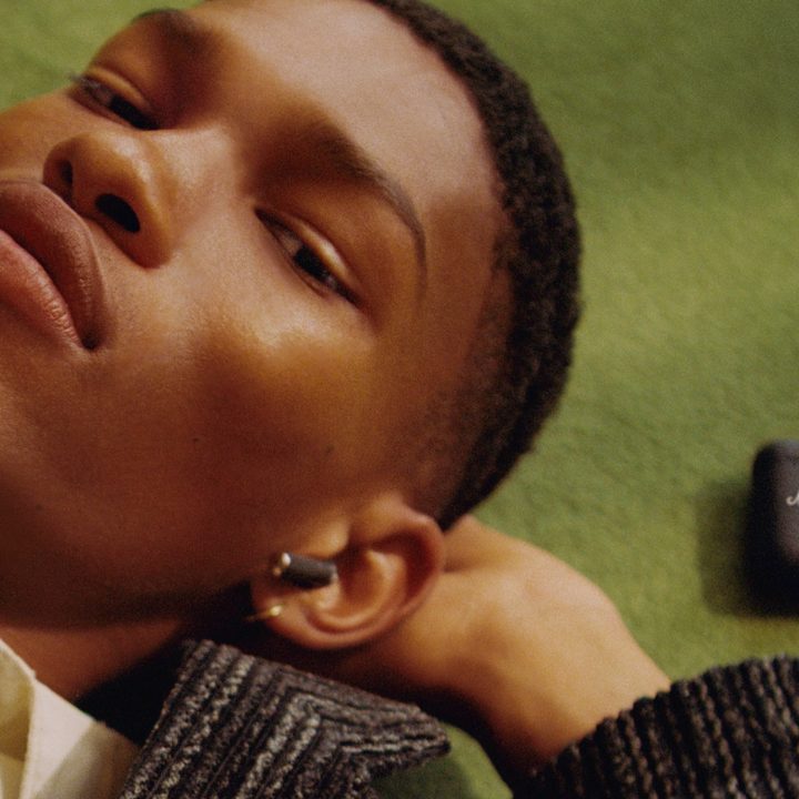 Man wearing Marshall Minor III true wireless earbuds.