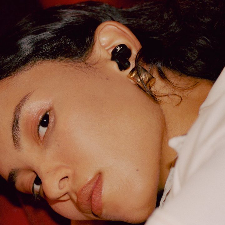 Woman wearing Marshall Motif ANC true wireless earbuds.
