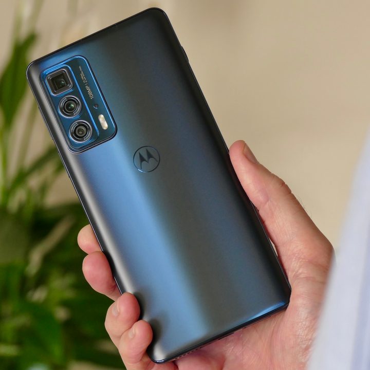 Moto Edge 20 Pro held in hand, seen from the back.