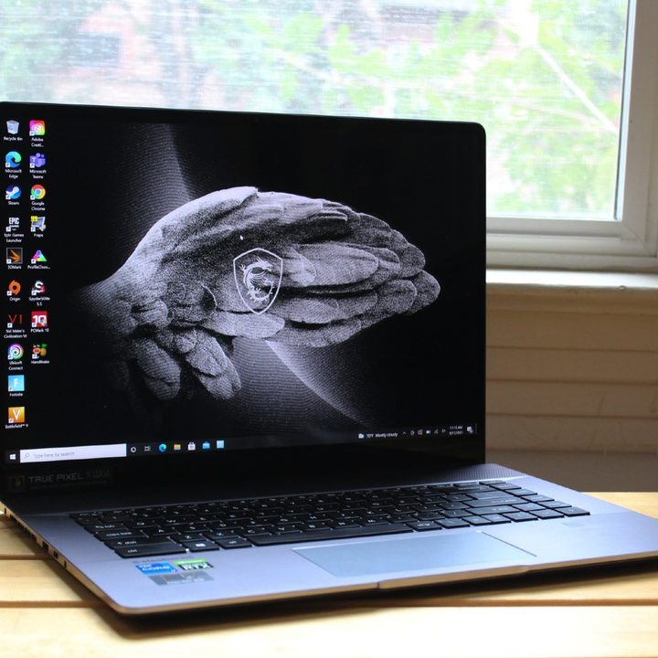 The MSI Creator Z16 open in front of a window.