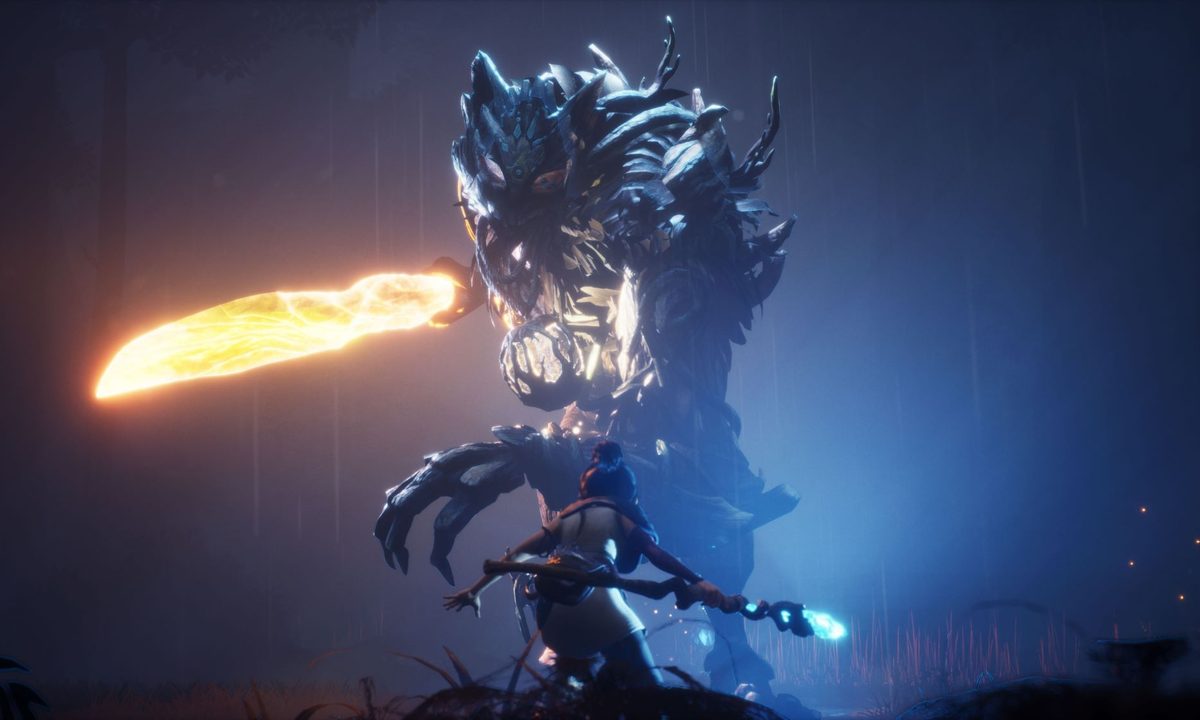 kena faces down a giant boss in Kena: Bridge of Spirits.