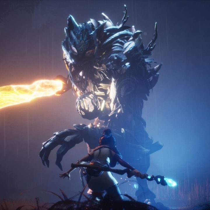 kena faces down a giant boss in Kena: Bridge of Spirits.