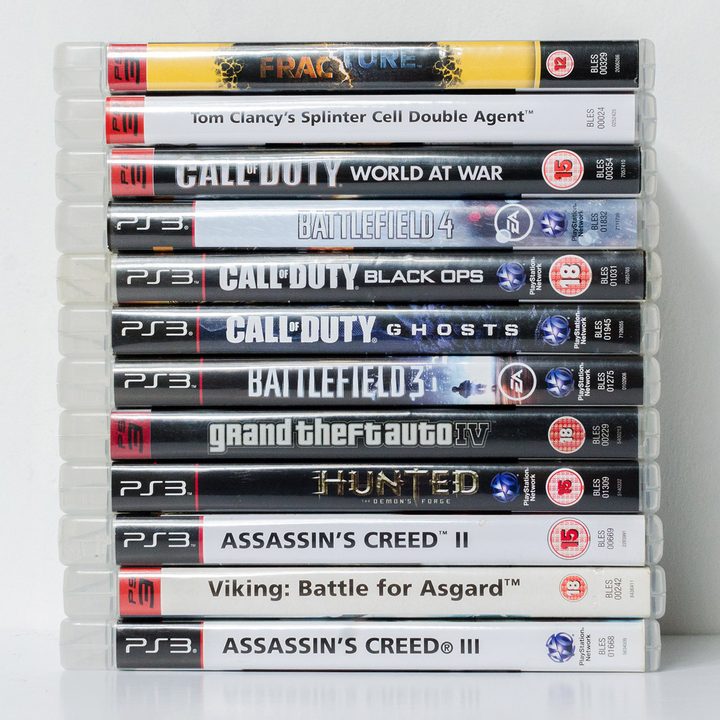 A stack of PS3 games.