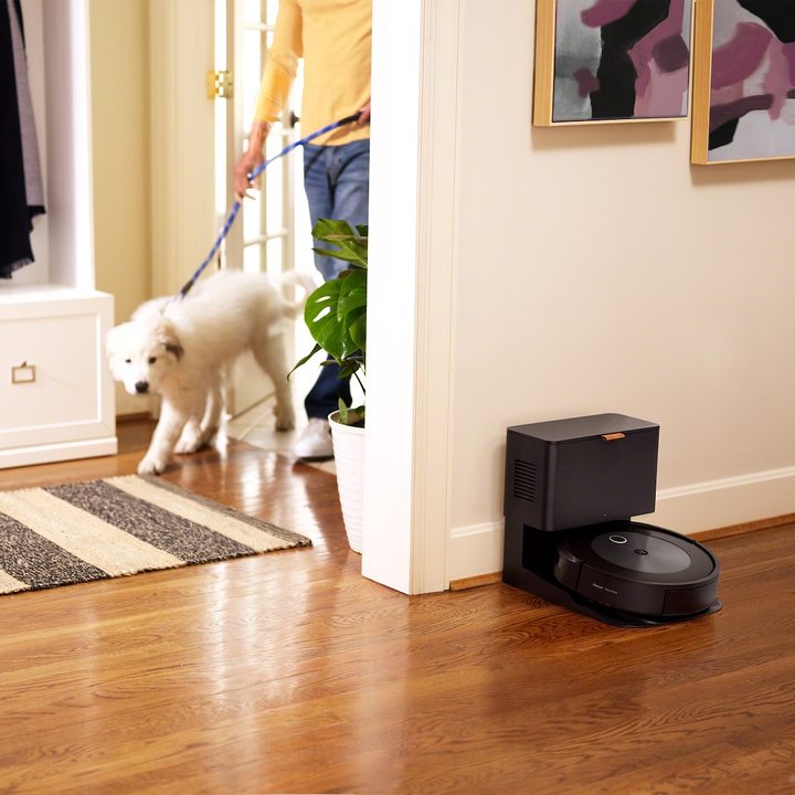 iRobbot Roomba j7+ docked against wall.