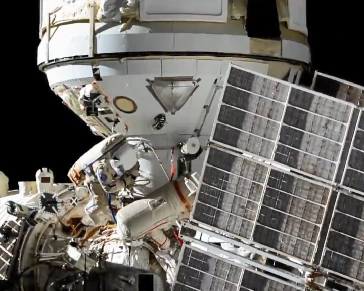 Cosmonauts Oleg Novitskiy and Pyotr Dubrov during a spacewalk to connect power and ethernet cables to the Nauka laboratory module.