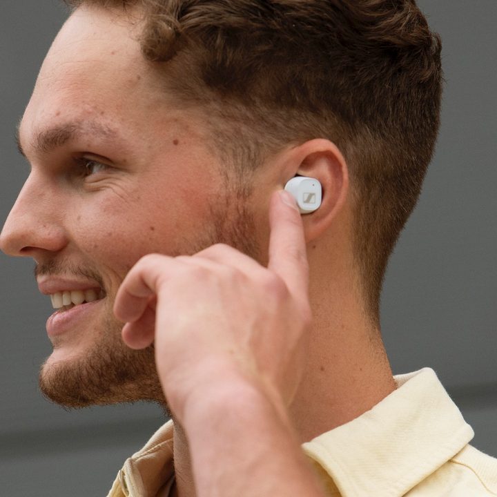 Man wearing Sennheiser CX Plus True Wireless earbuds.