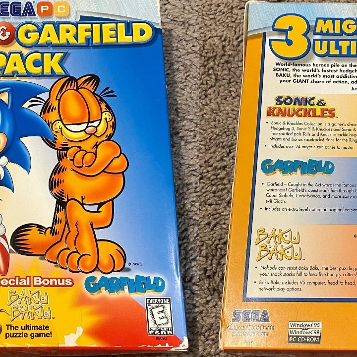 Sonic & Garfield game pack boxed lying on the floor.