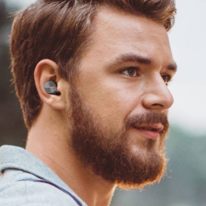 Man wearing Technics EAH-AZ60 noise canceling true wireless earbuds in black.