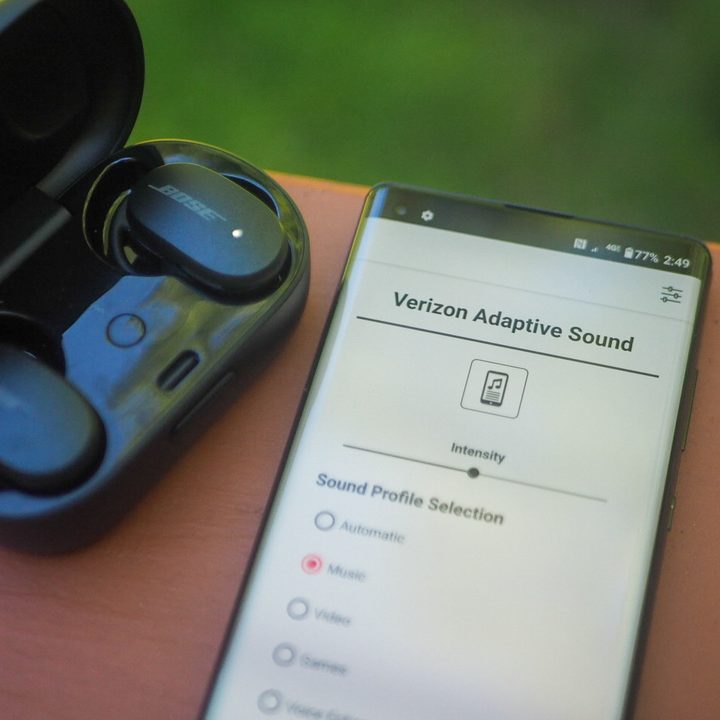 Verizon Adaptive Audio next to the Bose earbuds.
