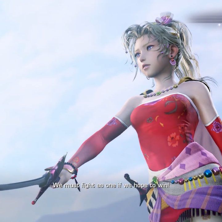 Terra in a red dress holding out her sword.