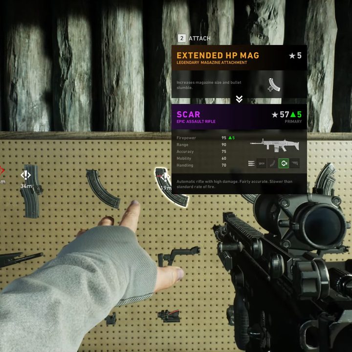 Picking out an attachment off a wall.