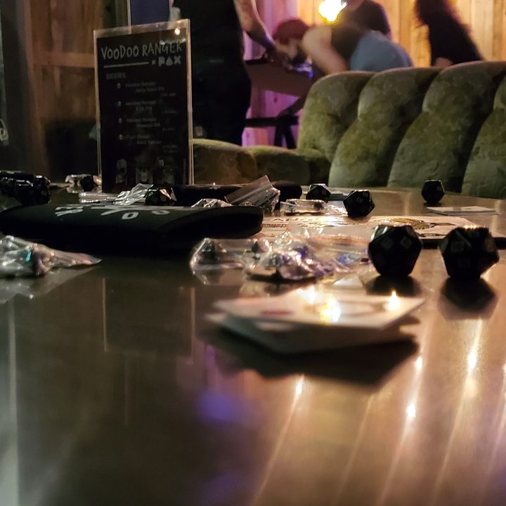 Merchandise celebrating the community meetup is spread on a table