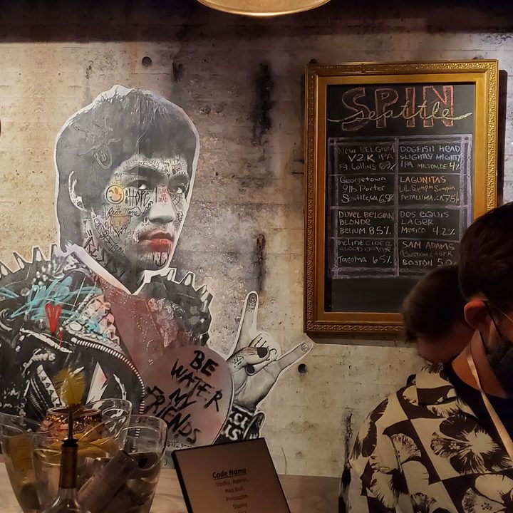 A mural of bruce lee, painted on the wall of a seattle bar.