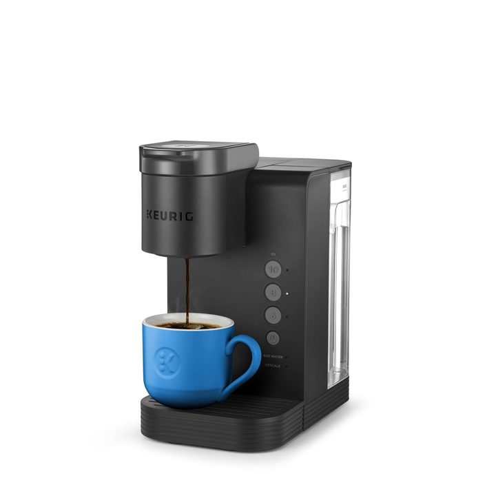 Keurig K-Express Essentials in black brewing coffee into a blue mug.