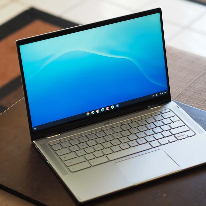 An Acer Chromebook Spin 514 sitting on a table (angled front view..