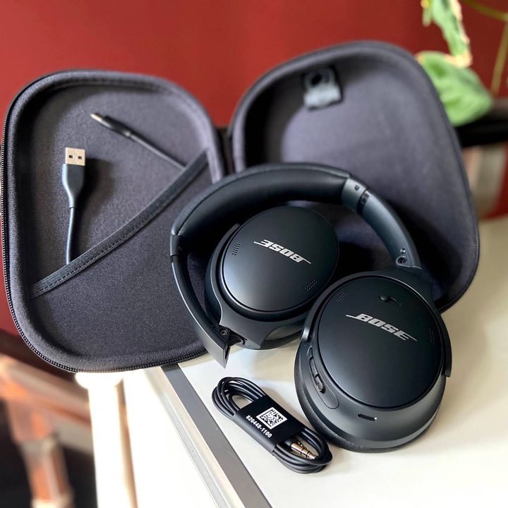 Bose QuietComfort 45 noise-canceling headphones with case and accessories.