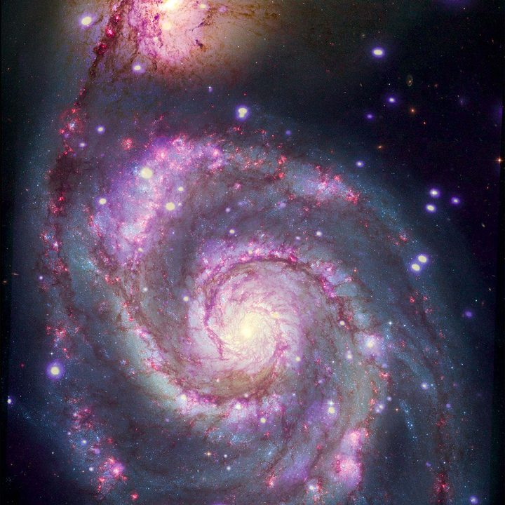 A composite image of M51 with X-rays from Chandra and optical light from NASA's Hubble Space Telescope contains a box that marks the location of the possible planet candidate.