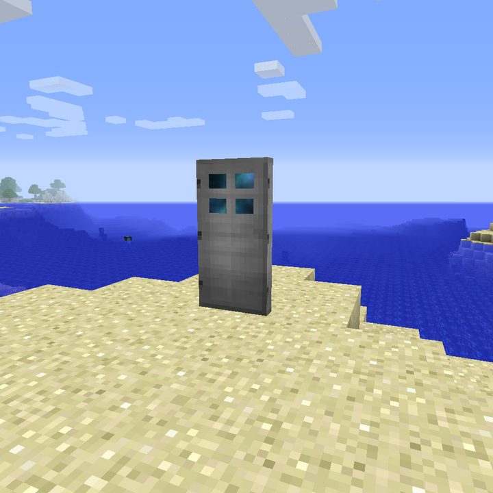 A dimensional door standing on the beach.