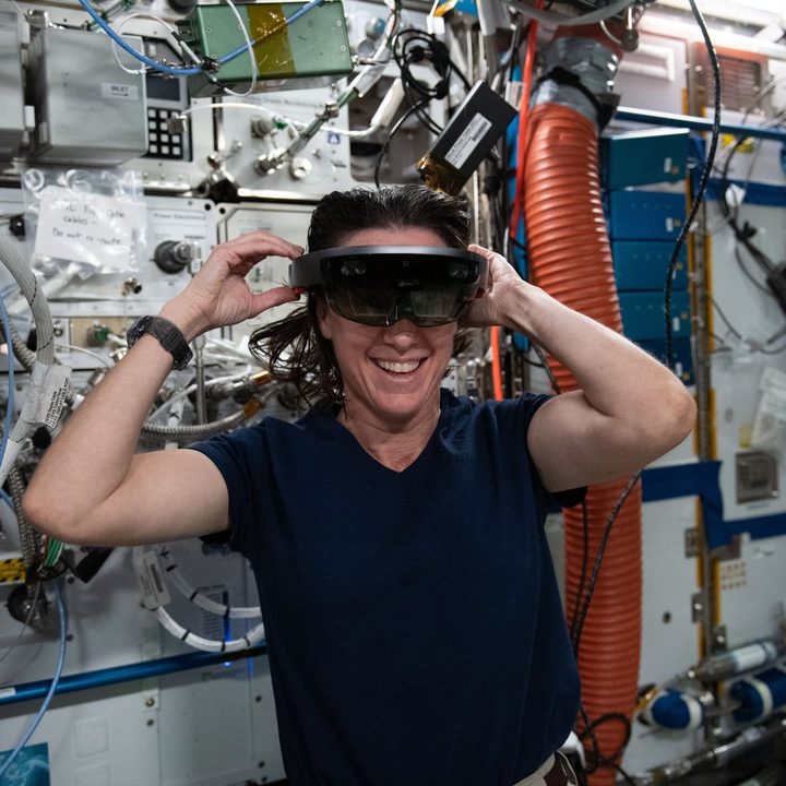 NASA Astronaut Megan McArthur dons a Microsoft HoloLens, a mixed reality (or augmented reality) headset, which allows her to see both the spacearound her as well as digital displays in her field of view.