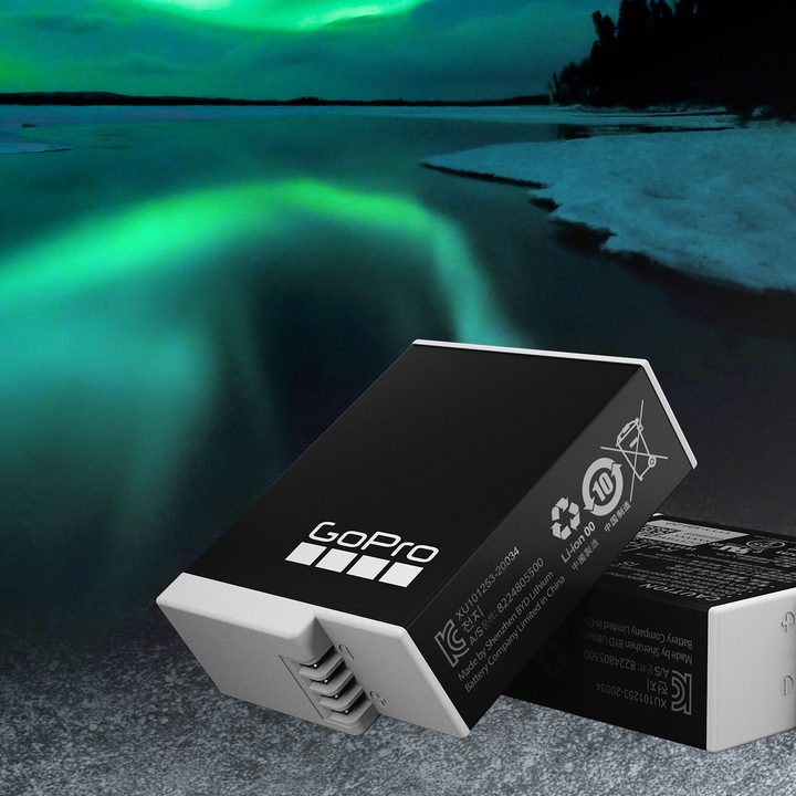 GoPro Enduro Battery against an Aurora Borealis backdrop.