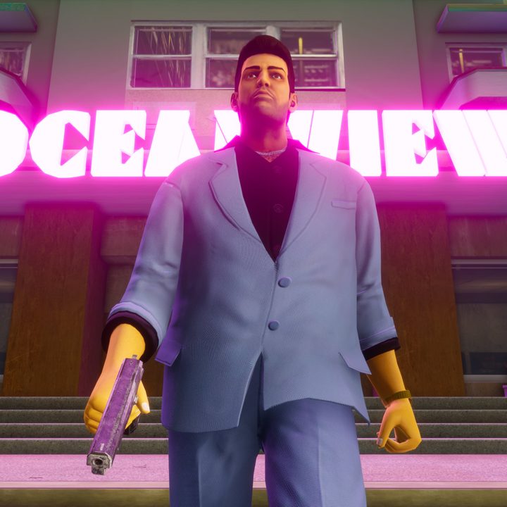 Grand Theft Auto City's main character stands in front of a neon sign.