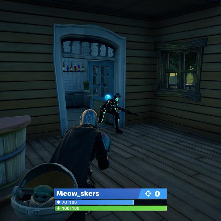 Battling a player in Fortnite.
