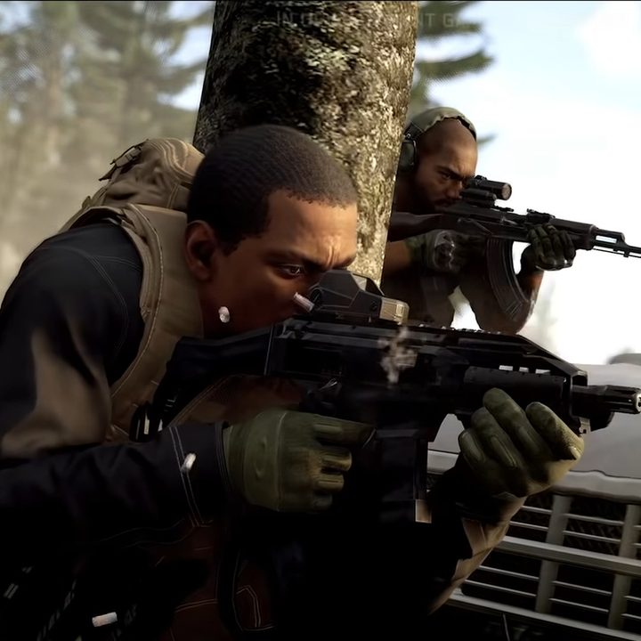Soldiers take cover behind a car in Ghost Recon Frontline.