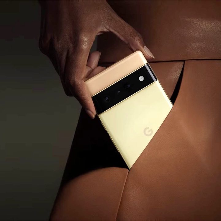 Pixel 6 Pro being slid into a leather skirt pocket.