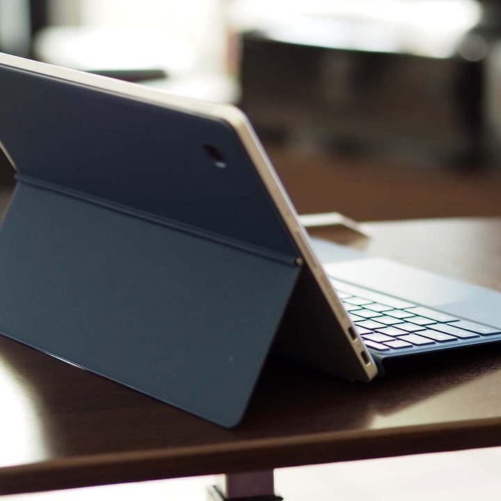 HP Chromebook x2 11 sitting on table top (back view).