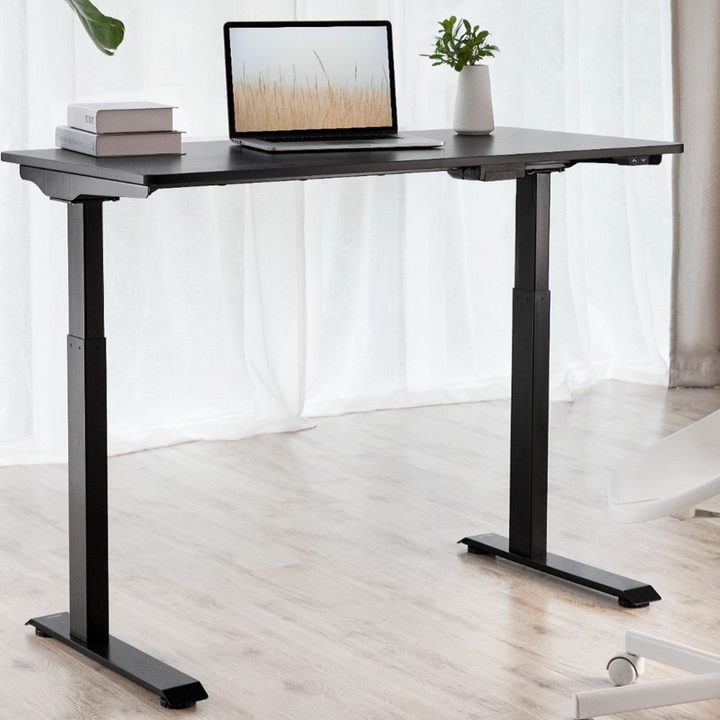 A laptop on the Insignia Adjustable Standing Desk.