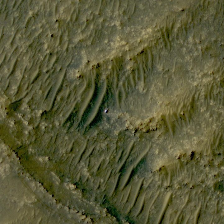 The white speck is NASA's Perseverance rover in the "South Séítah" area of Mars' Jezero Crater. The image was taken by the agency's Mars Reconnaissance Orbiter using its High-Resolution Imaging Science Experiment, or HiRISE, camera.