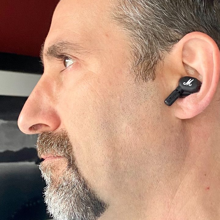 Man wearing Marshall Motif ANC true wireless earbuds.