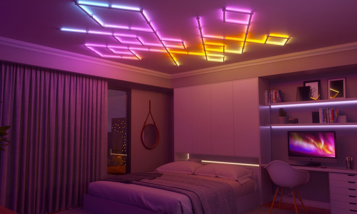 Nanoleaf Lines lights installed on the ceiling in a bedroom.
