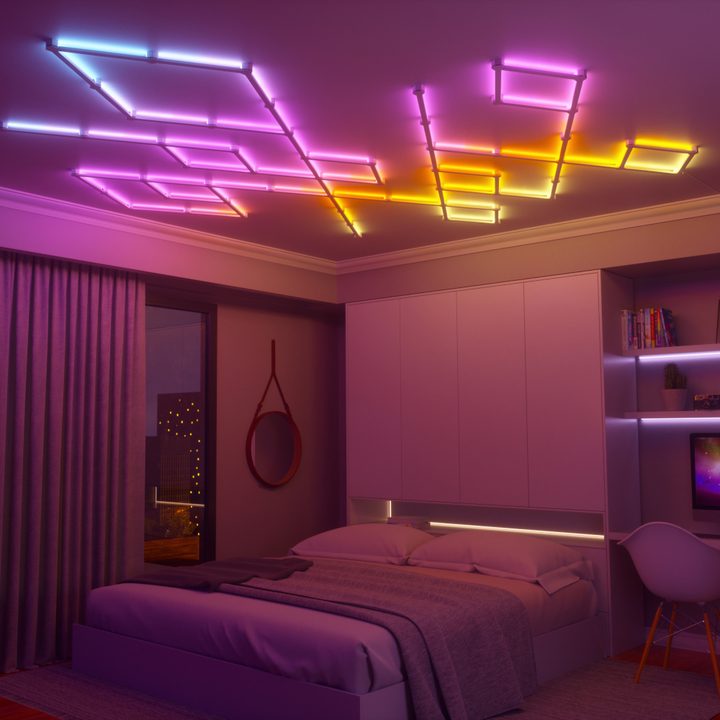 Nanoleaf Lines lights installed on the ceiling in a bedroom.