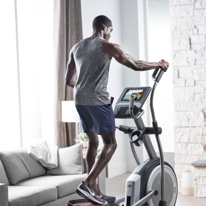 Man Working Out with NordicTrack Elliptical Machine