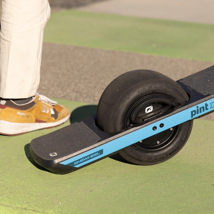 Onewheel Pint X on green background.