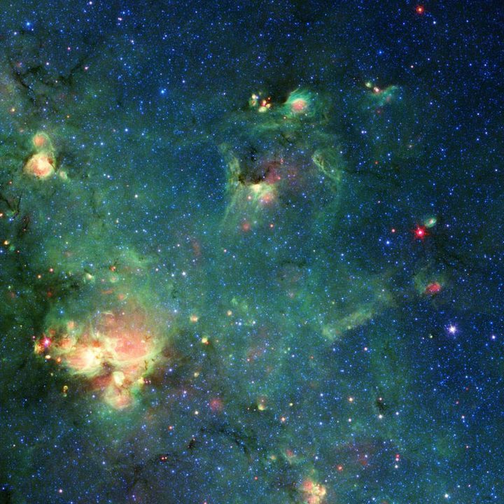NASA’s Spitzer Space Telescope imaged this cloud of gas and dust. The colors represent different wavelengths of infrared light and can reveal such features as places where radiation from stars had heated the surrounding material. Any resemblance to Godzilla is purely imaginary.