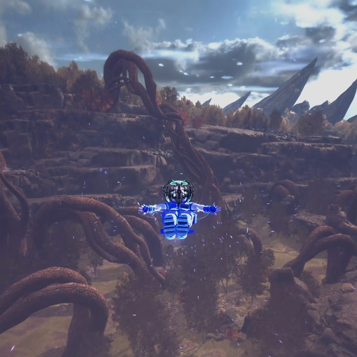 Raymond flyingg over a dusty canyon.