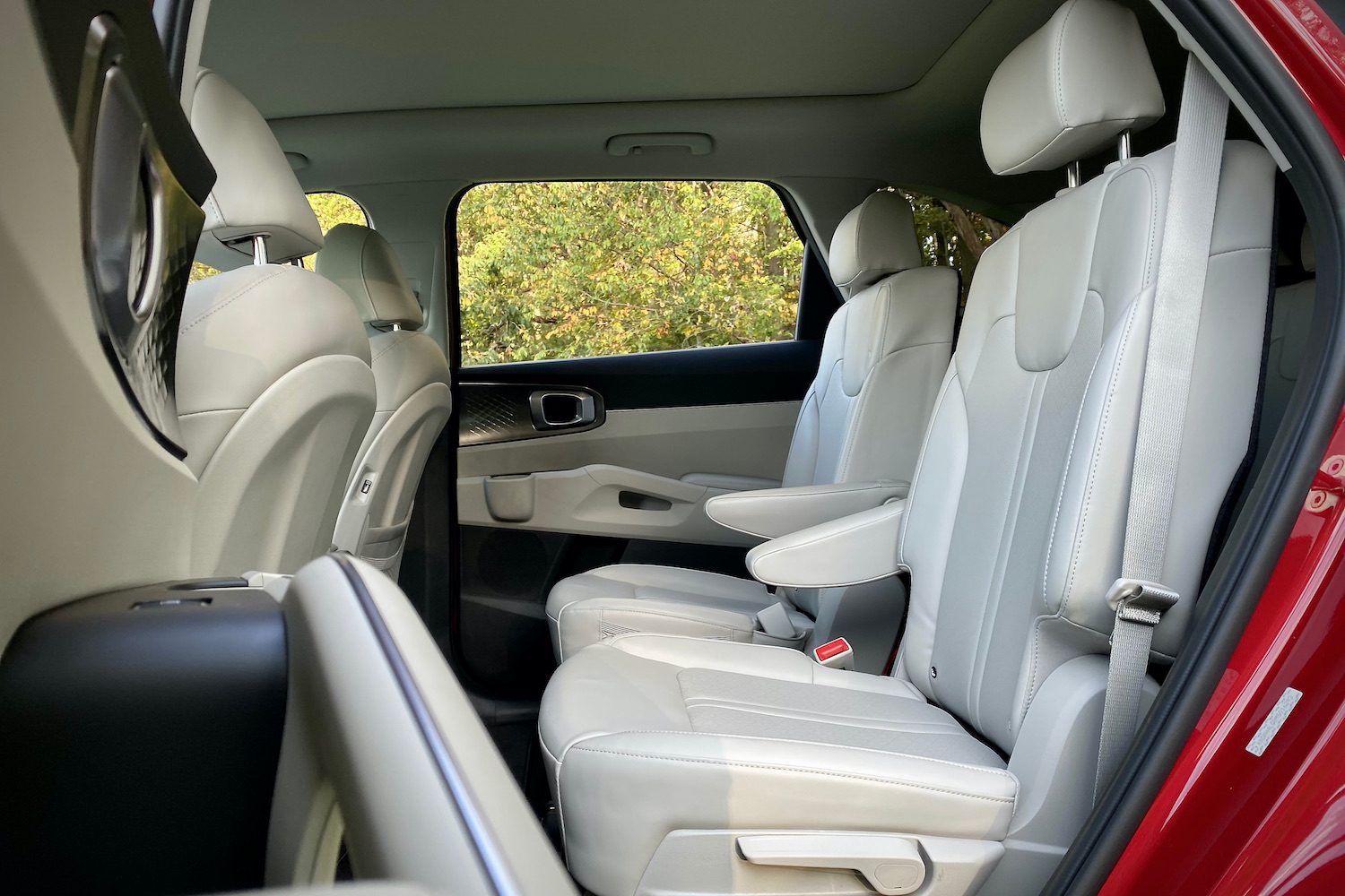 Second-row seats in the 2021 Kia Sorento Hybrid with trees in the background.