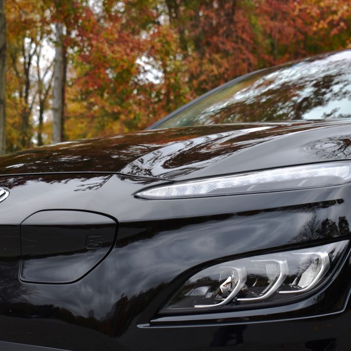 Up close view of the 2022 Hyundai Kona Electric's headlights and charge port.