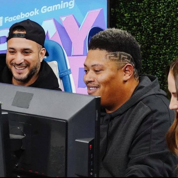 Content creators laugh together at Facebook Gaming's PLAYLOUD event.