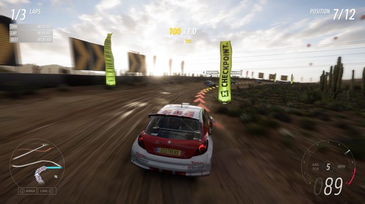 A car following the racing line as it changes color around a corner in Forza Horizon 5.
