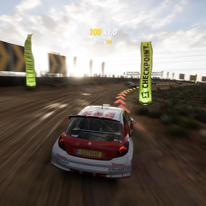 A car following the racing line as it changes color around a corner.