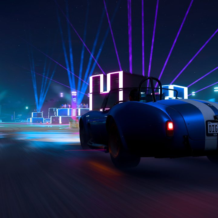 A car following the racing line as it changes color around a corner.