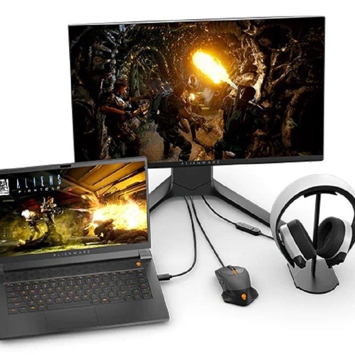 Alienware M15 R6 gaming laptop next to a gaming monitor, mouse, and a headset, all on a white background.